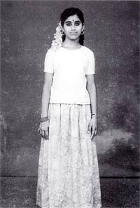 Mother Meera as a young girl standing
